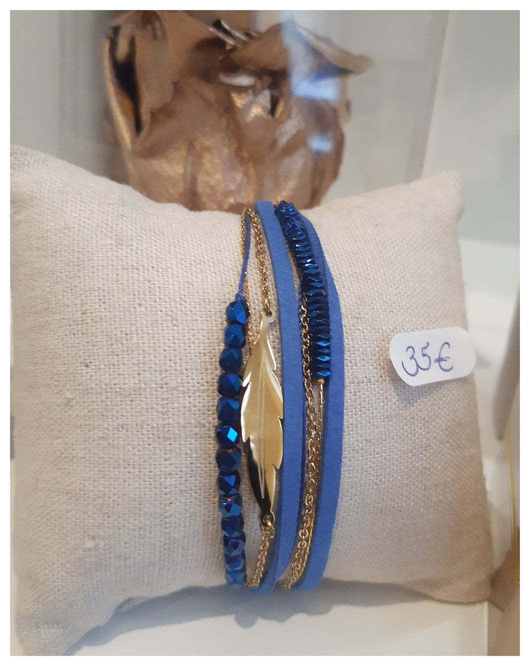 Très beau bracelet inox doré & liens bleus