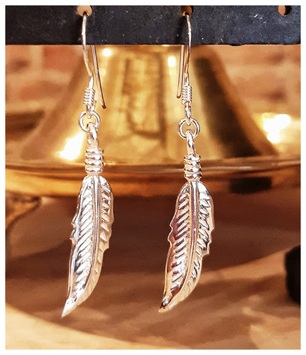 Jolies boucles d'oreilles plumes en argent